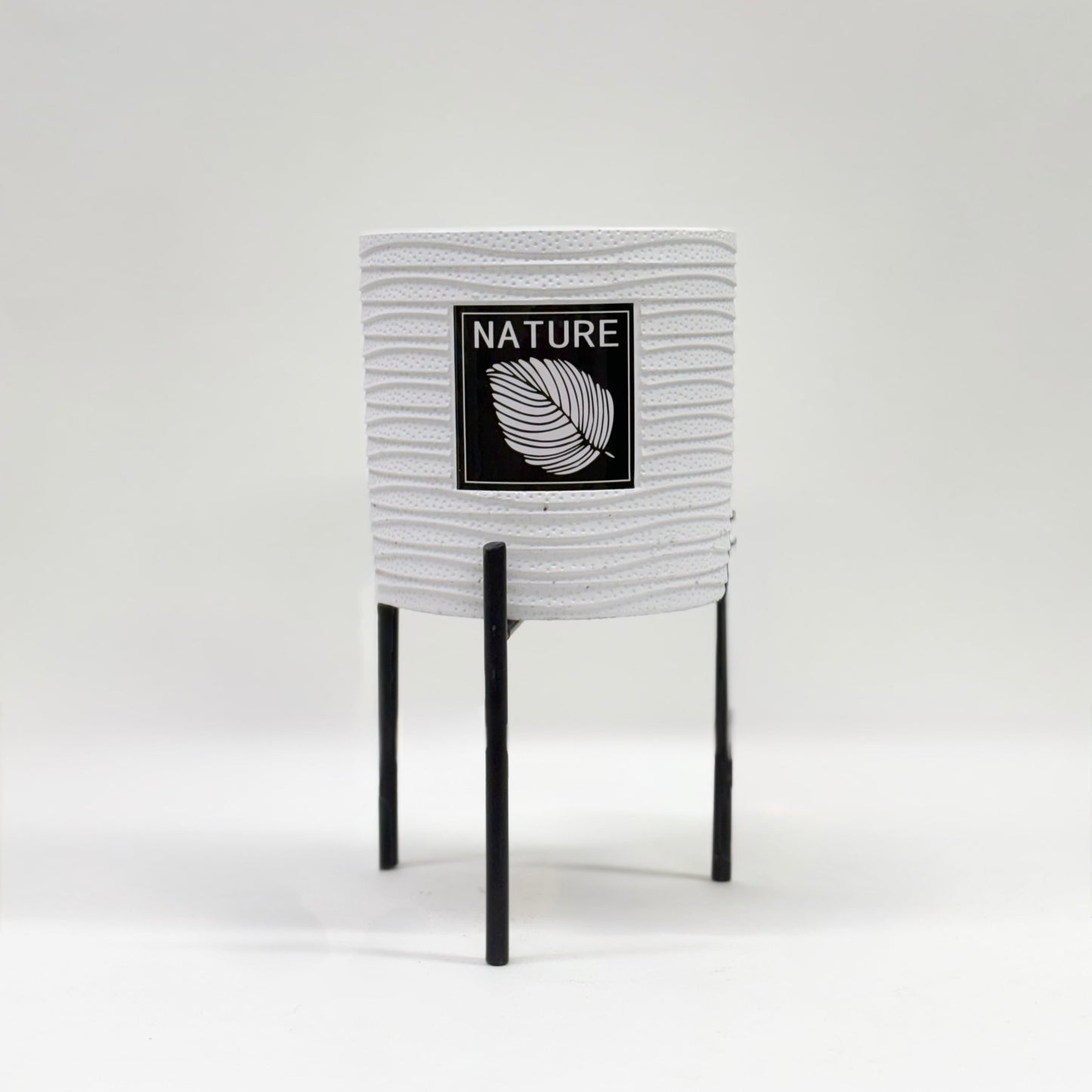 Nature-Inspired White Ceramic Planter with Black Metal Stand