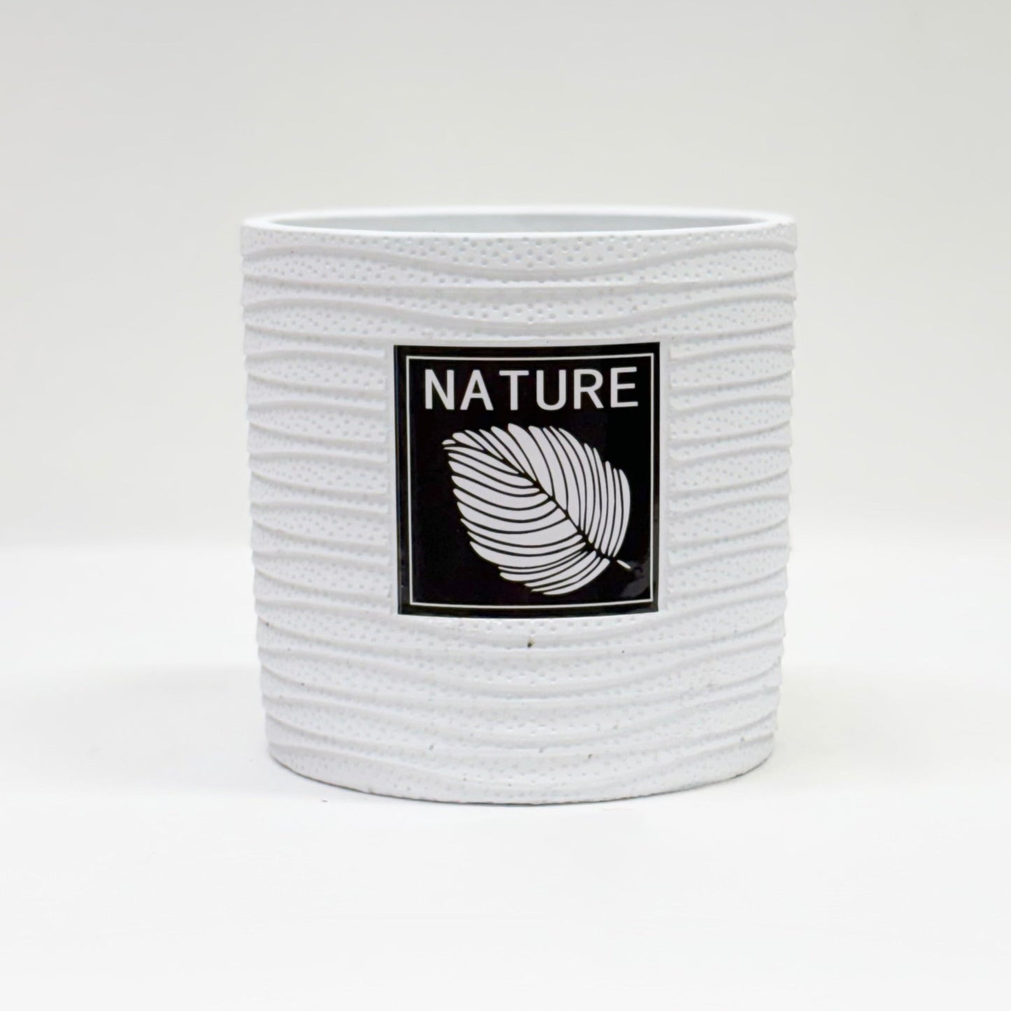 Nature-Inspired White Ceramic Planter with Black Metal Stand