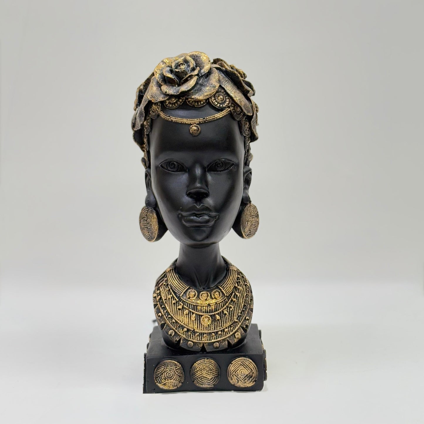 African Heritage Black Sculpture with Gold Detailing