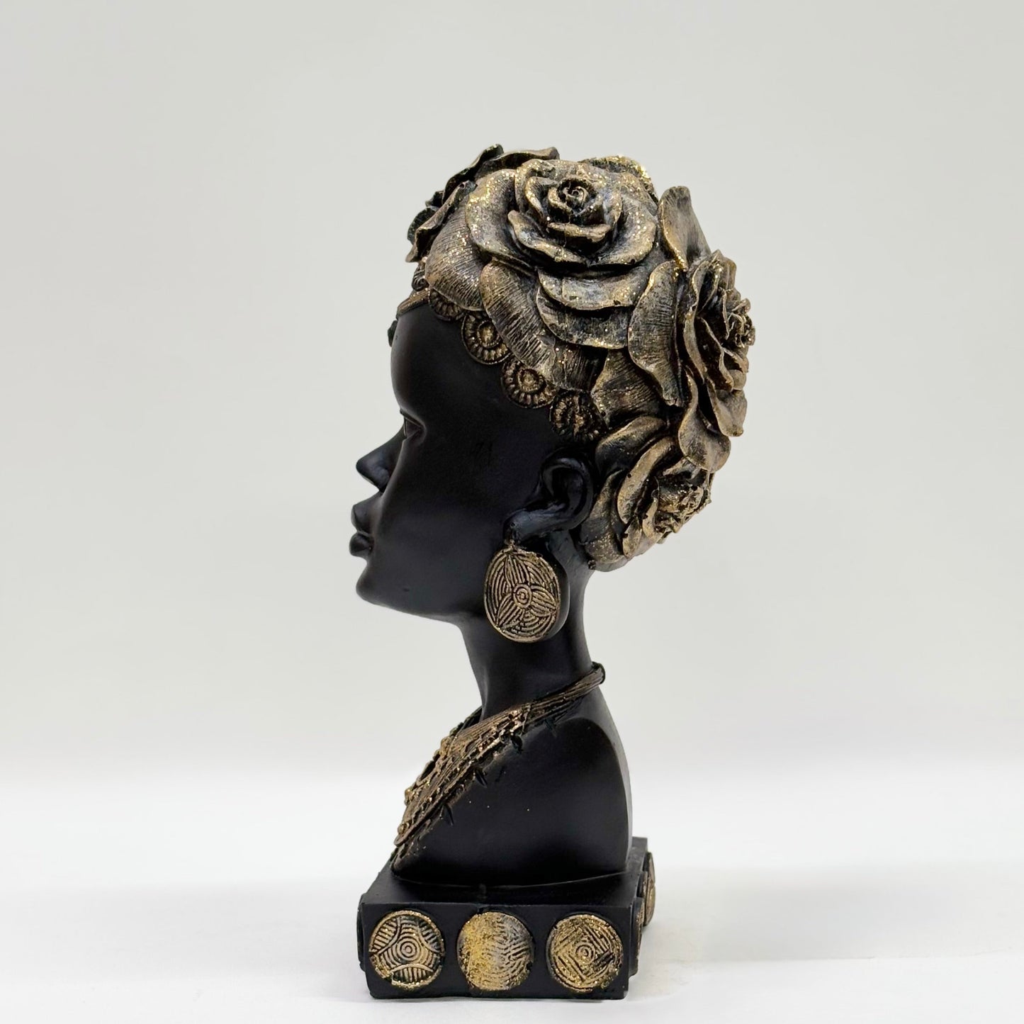 African Heritage Black Sculpture with Gold Detailing