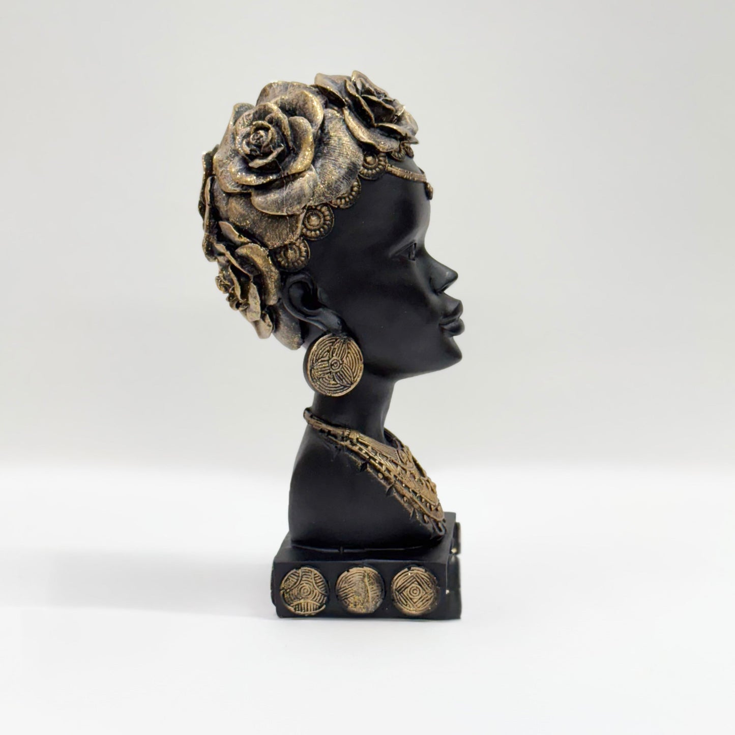 African Heritage Black Sculpture with Gold Detailing